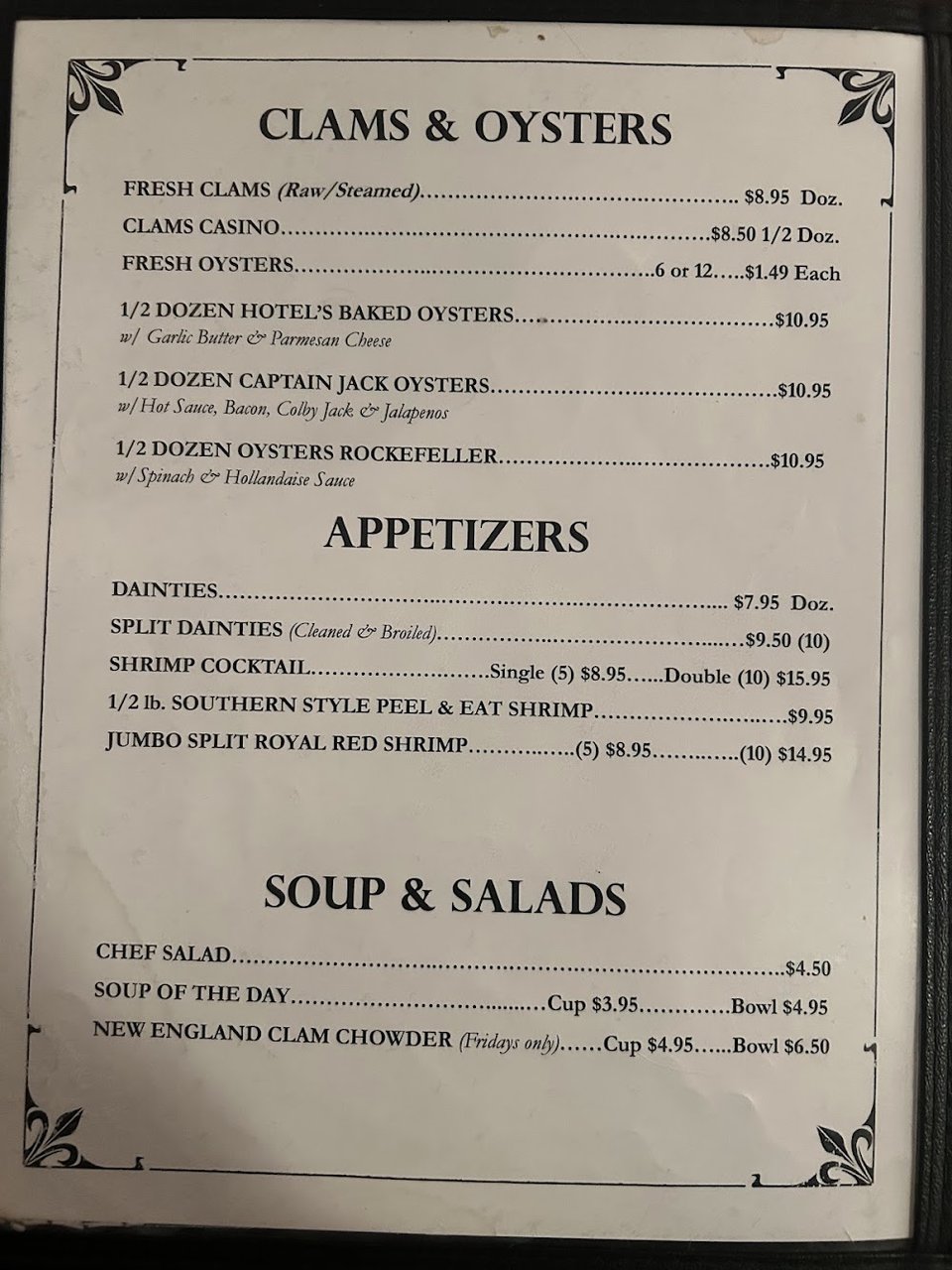 Printed menu with appetizers and salads.